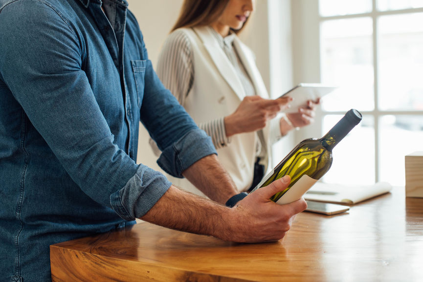 A Man Holding Bottle Of Wine
