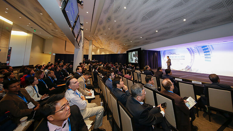 Levi's Stadium Conference Room - Guests watching a business presentation with man on stage in front